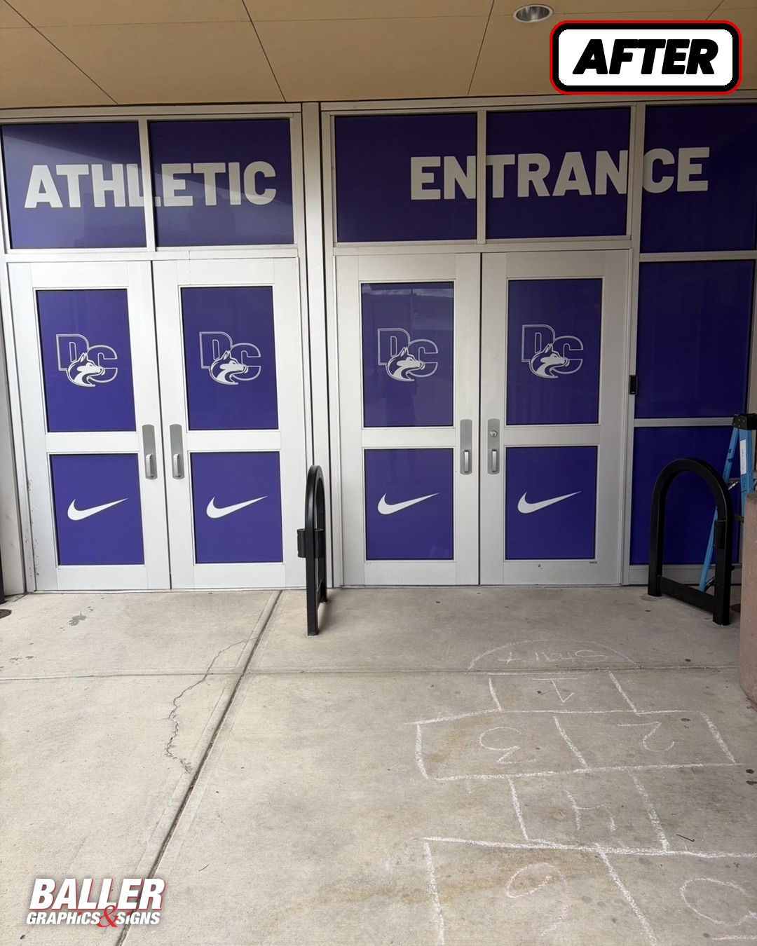 ATHLETIC ENTRANCE window and door graphics with DC Husky and Nike branding at Douglas County High School in Castle Rock, Colorado